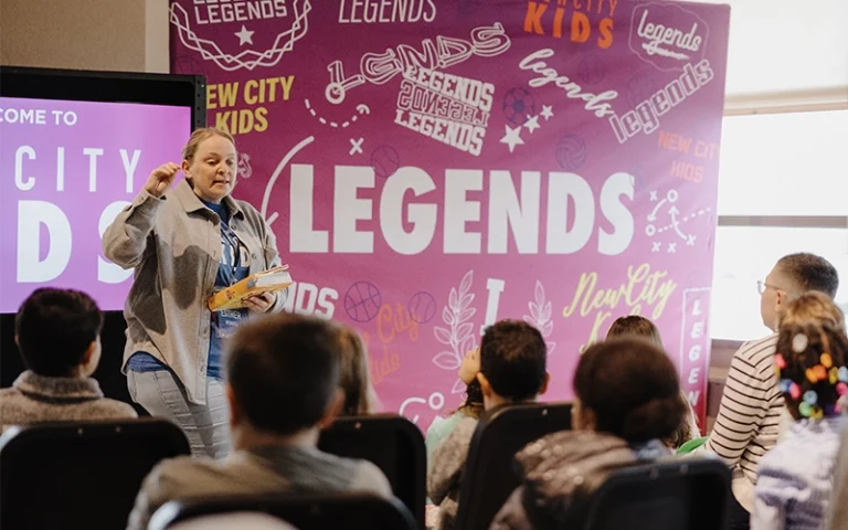 A teacher leading a kids' church program during Palm Sunday at New City Church in Naperville.